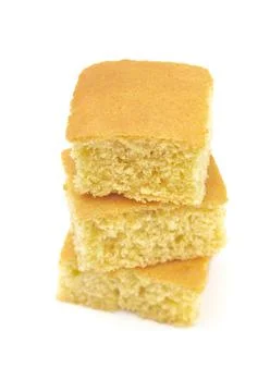 Square Cornbread Slices on a White Background Foto stock