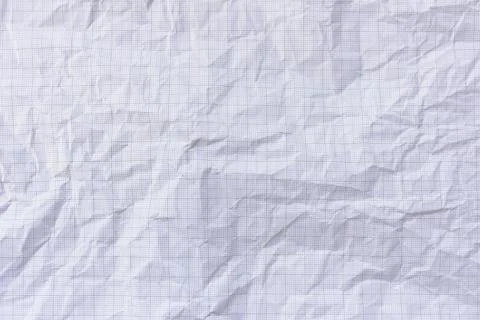 Square crumpled square graph paper on the background. Stock Photos