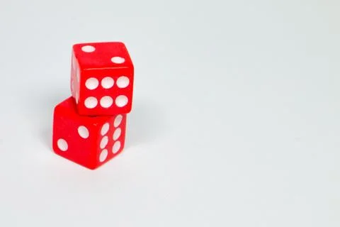 Square dice in red on a white background Stock Photos