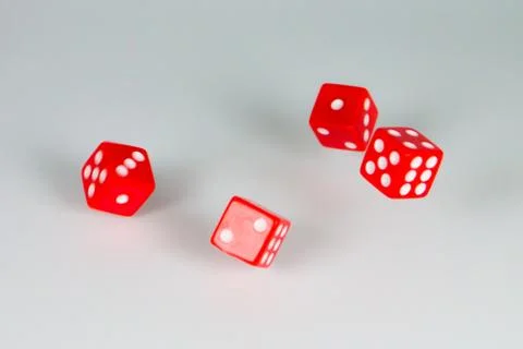 Square dice in red on a white background Stock Photos