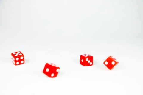 Square dice in red on a white background Stock Photos