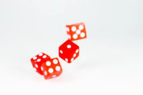 Square dice in red on a white background Stock Photos