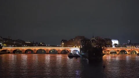Square du Vert-Galant and Pont Neuf in Paris at Seine River at night Video stock 331304454