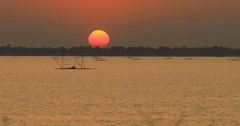 The square fishnet made of bamboo of Thai fisherman,Big bright sun Stock Footage 117454825