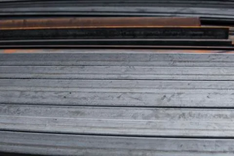 Square flat-rolled pipe metal profile in packs at the warehouse of metal Stock Photos