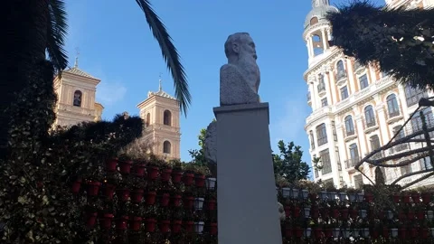 Square with flowers Sculpture. Blue sky and palm trees. Murcian history. Spain. Stock Footage 224872155
