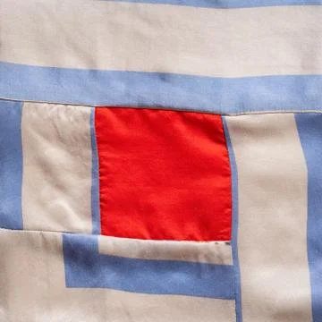Square fragment of hand-stitched patchwork cloth Stock Photos