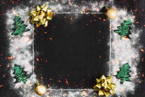 Square frame on the chalk board with festive golden bows,golden christmas bal Stock Photos