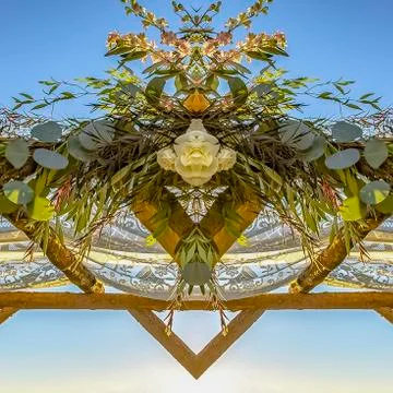 Square frame Chuppah refleced in half at a Jewish wedding with sunset behind Stock Photos
