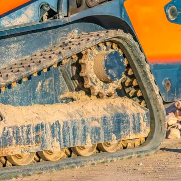 Square frame Close up of the dirty rubber track of a heavy duty construction Stock Photos