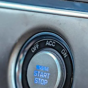Square frame Close up view of an engine push start and stop button inside a Stock Photos