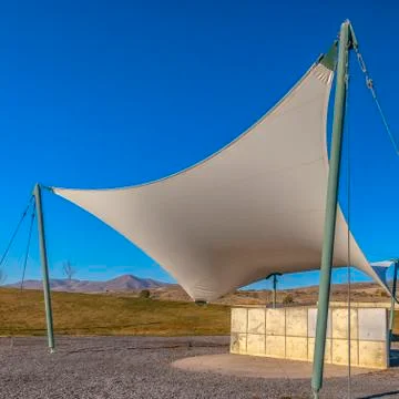 Square frame Concrete rectangular structure under a white canopy viewed on a Stock Photos