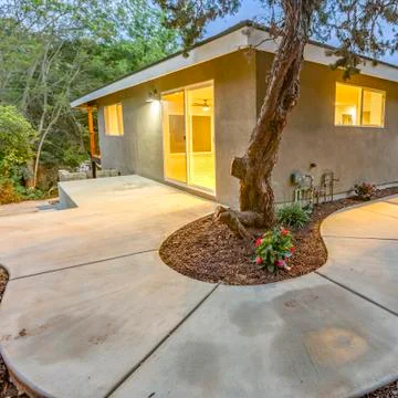 Square frame Corner of building with rounded sidewalk twilight Stock Photos