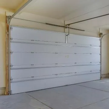 Square frame Empty garage with white doors as well as arched and rectangular Stock Photos