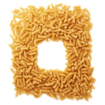Square frame made of dry rotini pasta over isolated white background Stock Photos