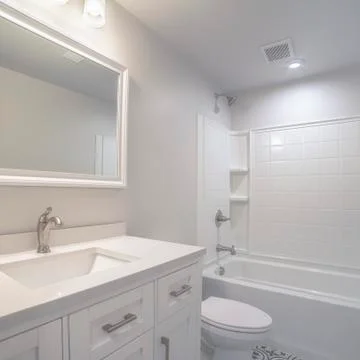 Square frame Modern fitted white bathroom interior of home Stock Photos