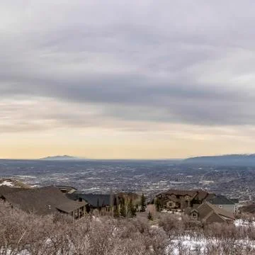 Square frame Panoramic view of a valley amd mountain under vast cloud filled sky Stock Photos