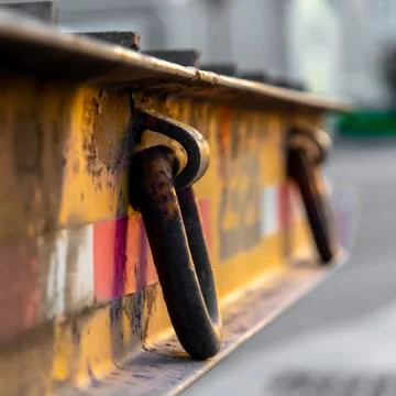 Square frame Platform with rusty metal rings on the side and raised bands at the Stock Photos
