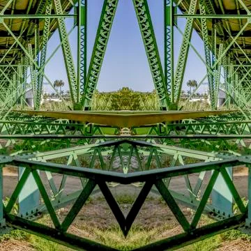 Square frame Symmetrical design created from doubling a photo of a green bridge Foto stock