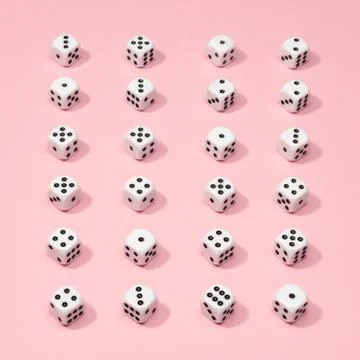 Square gaming dice pattern on pink background in flat lay style Stock Photos