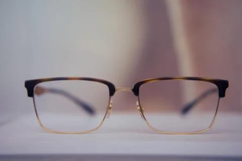 Square glasses with brown frames close up on a store shelf Stock Photos
