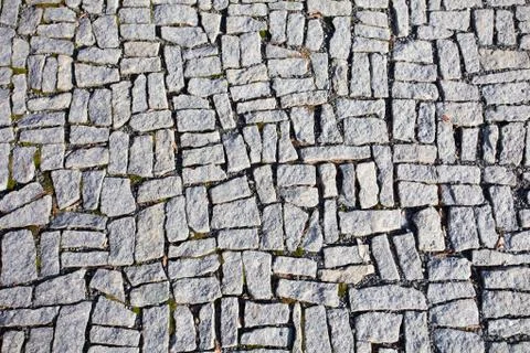 Square granite stones on the pavement background Stock Photos