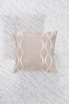 Square Gray Throw Pillow on Marbled Backdrop Casting Shadow Stock Photos