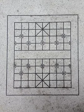 Square grid pattern engraved on concrete surface Stock Photos