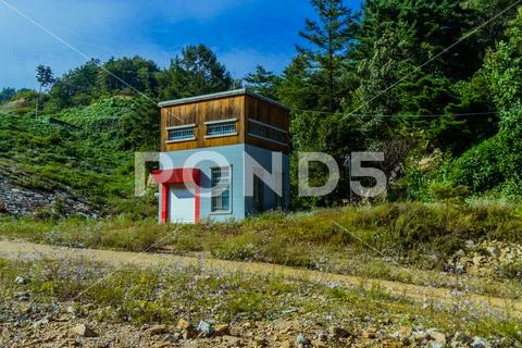 Square house with red awning over garage Stock Photos