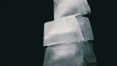 Square Ice Cubes are Spinning on a Black Background Stock Footage 171859639