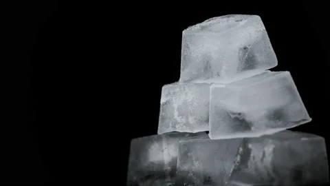 Square Ice Cubes are Spinning on a Black Background Stock Footage 171877944