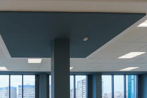 Square lamp on a white office ceiling. Interior design in the office. A fluor Stock Photos