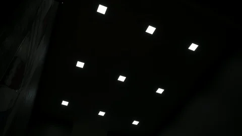 Square Led lamps built into the ceiling glowing in the dark. To include / swi Stock-Footage 119340024