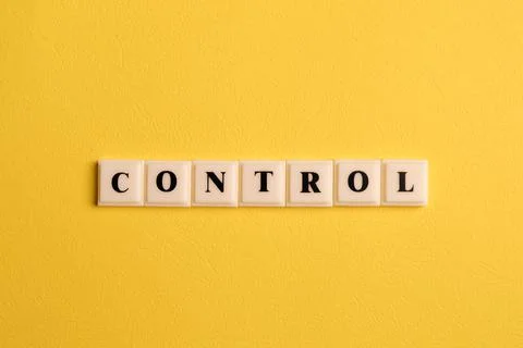 Square letters with text CONTROL isolated on yellow background Stock Photos