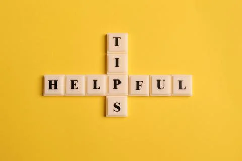 Square letters with text HELPFUL TIPS isolated on yellow background Stock Photos