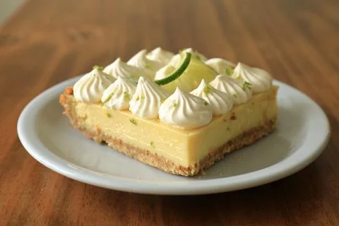 Square Lime Cheesecake Dessert on Rustic Wooden Table Stock Photos