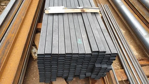 Square metal beam. Metal structures. Channel, industrial construction. Stock Footage 248617721