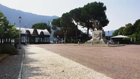 Square with monument of cernobbio town and people walking Stock Footage 118650110