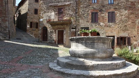 The square named after the Sienese painter Lorenzo di Pietro "il Vecchietta" Stock Footage 99654215