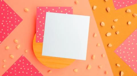 Square note sheets,wooden base,yellow beige paper, pebbles.Design copy space Stock Photos