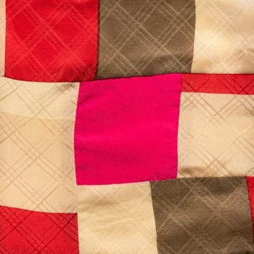 Square ornament on hand-sewn patchwork cloth Stock Photos