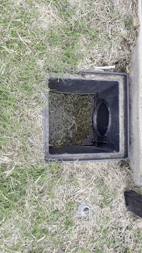 Square Outdoor Drain in Dry Grass Stock Footage 345514981