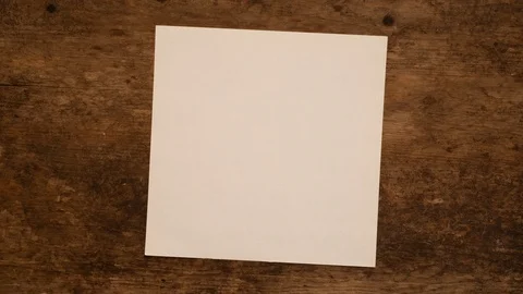 Square Paper Background. Unfolding and folding of a square sheet of paper. Stock Footage 95053520