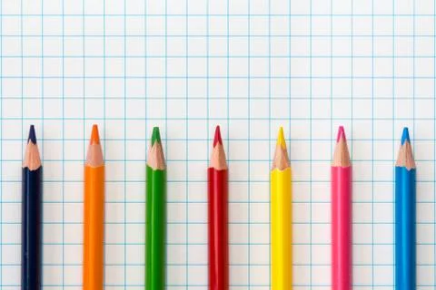 Square paper sheet and colored pencils Stock Photos