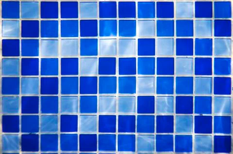 Square pattern of blue and light blue tiles for bath walls and floor design o Stock Photos