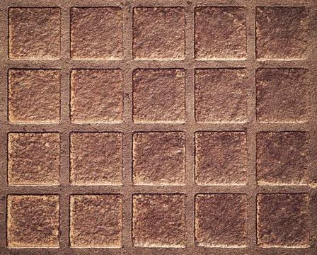 Square pattern on the rusty iron hatch Stock Photos