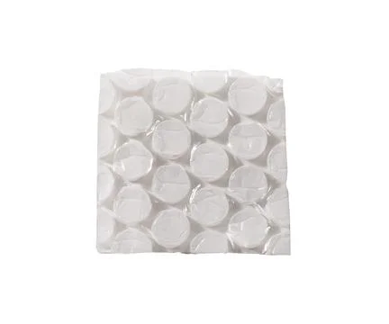 Square piece of bubble wrap with circular cells, smooth surface, and clean cu Stock Photos
