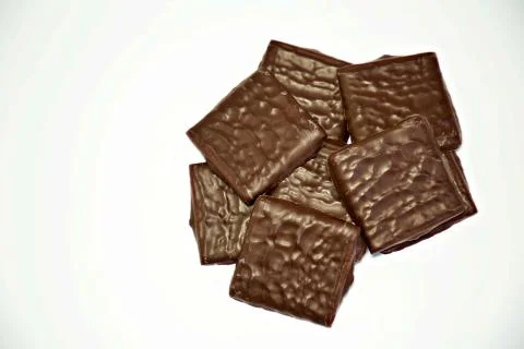 Square pieces of chocolate Stock Photos