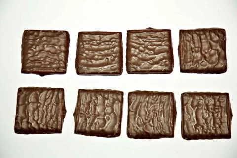 Square pieces of chocolate Stock Photos