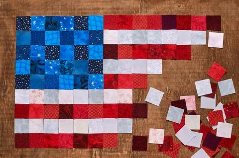 Square pieces of fabrics lying like a flag of USA Stock-Fotos